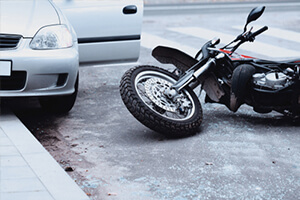 a motorcycle lies on the ground