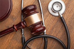 a gavel on top of a stethoscope