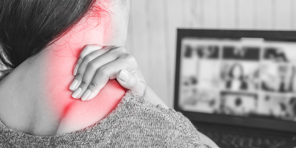 a woman clutches her neck in pain